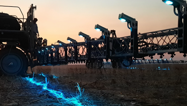 Tractor at Sunset in a field